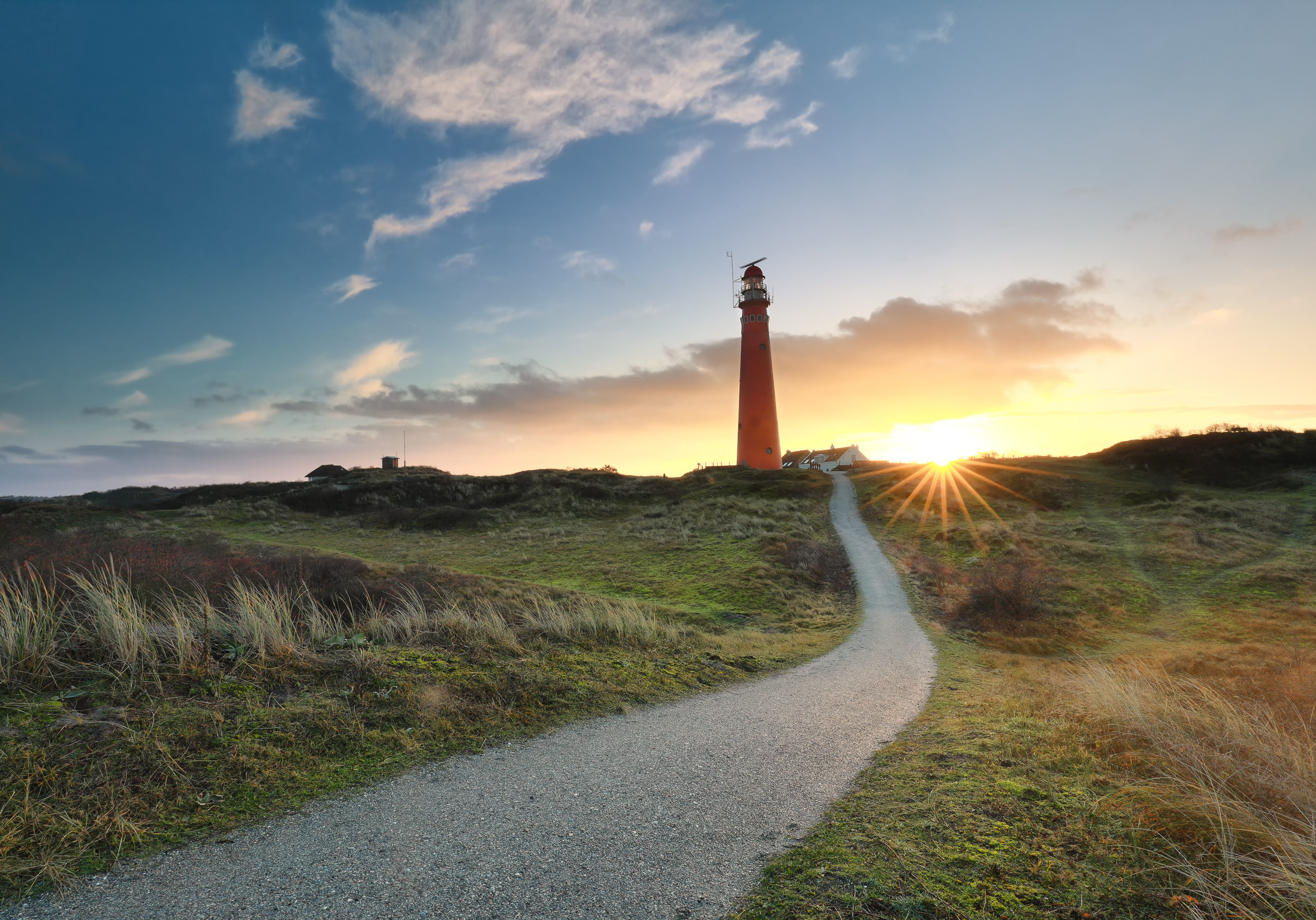 path to red lighthouse at sunrise, Schiermonnikoog, Netherlands